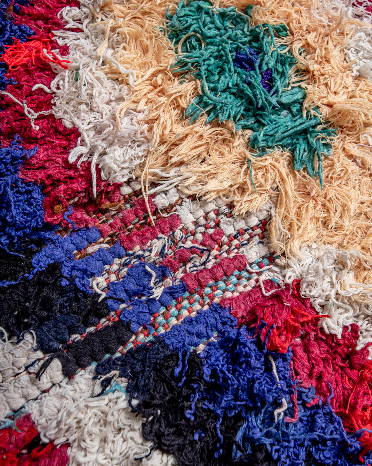 Modern designer vintage handcrafted Berber rug from Morocco. Boucherouite runner rug with beautiful colors and patterns.